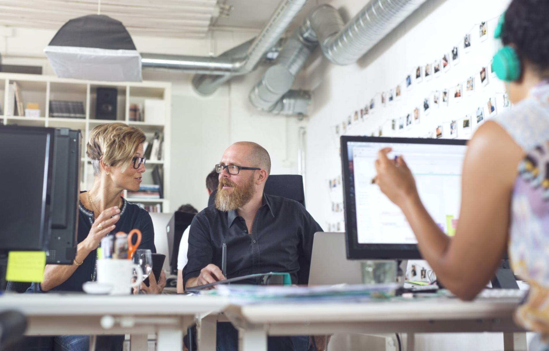 Marketing strategy workspace with digital tools and planning materials